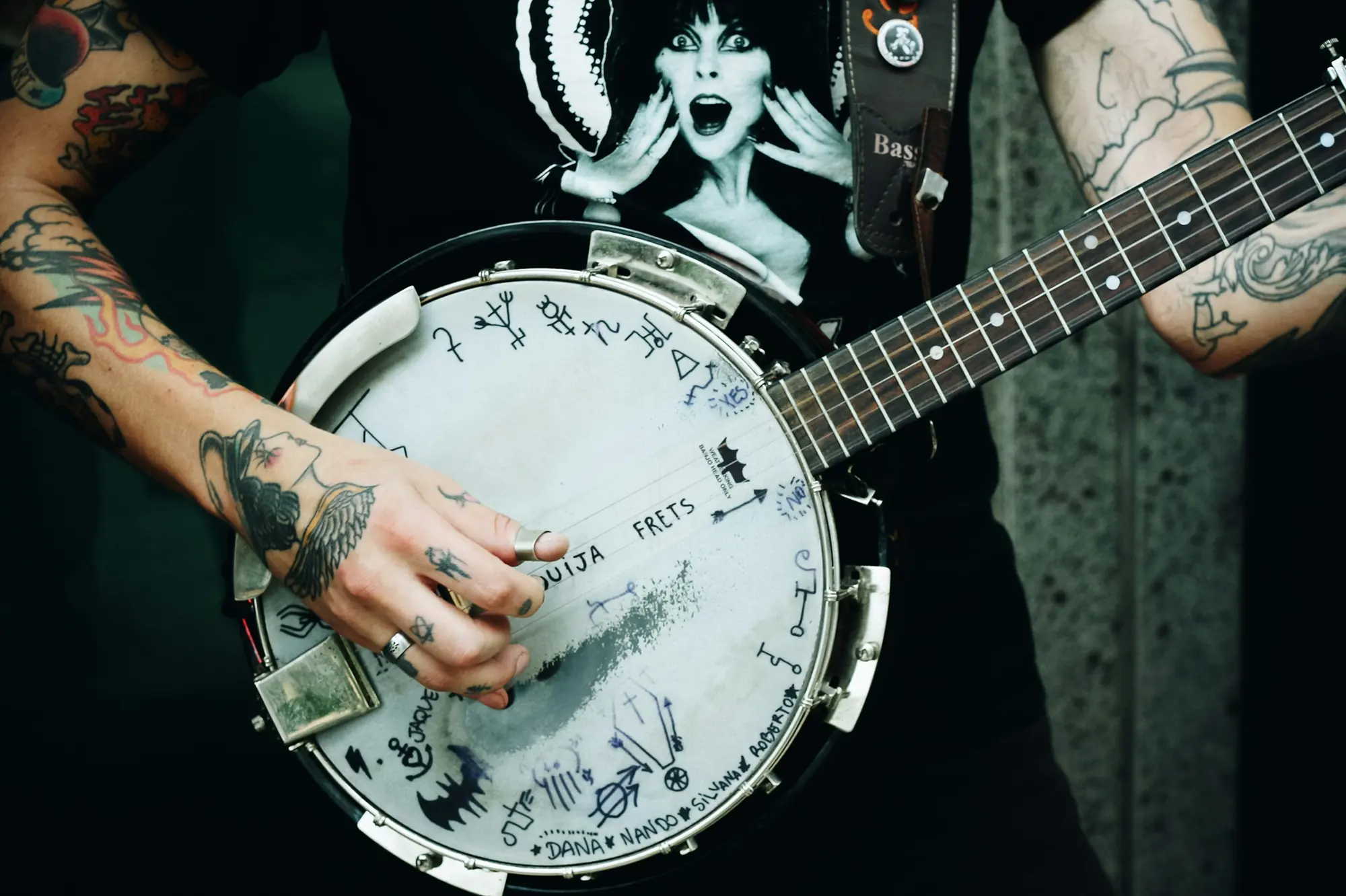 A player’s hands on a five-string banjo