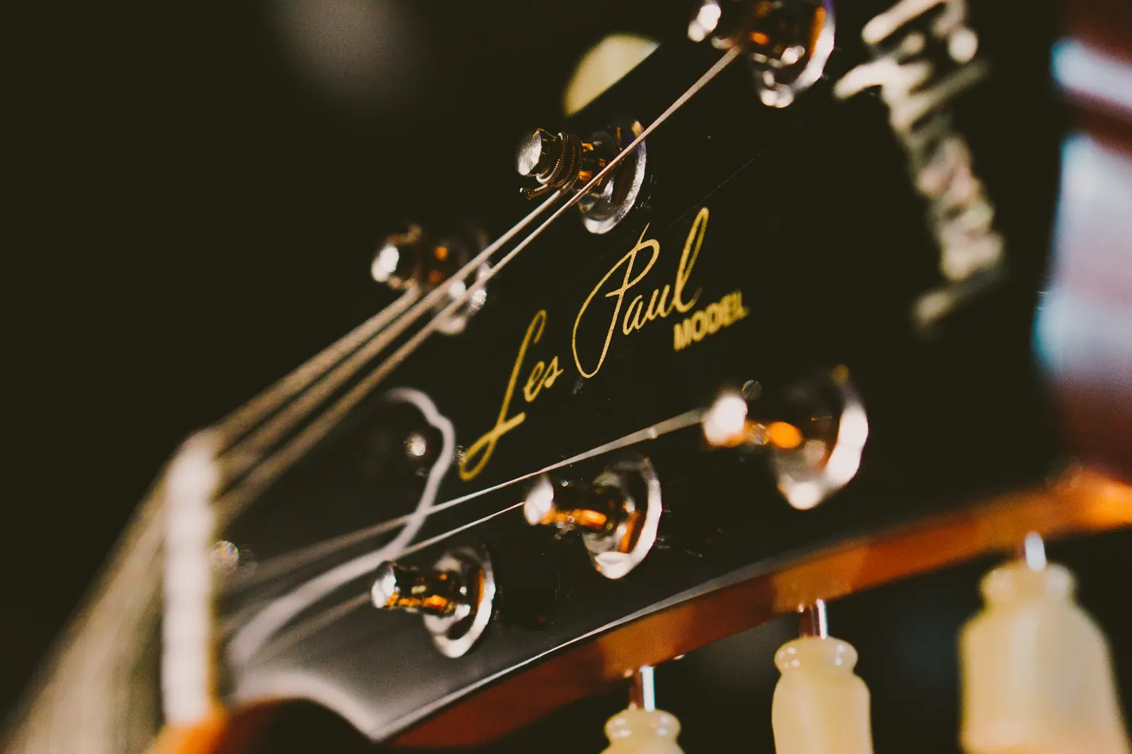 A Les Paul headstock with its nickel tuners, close up